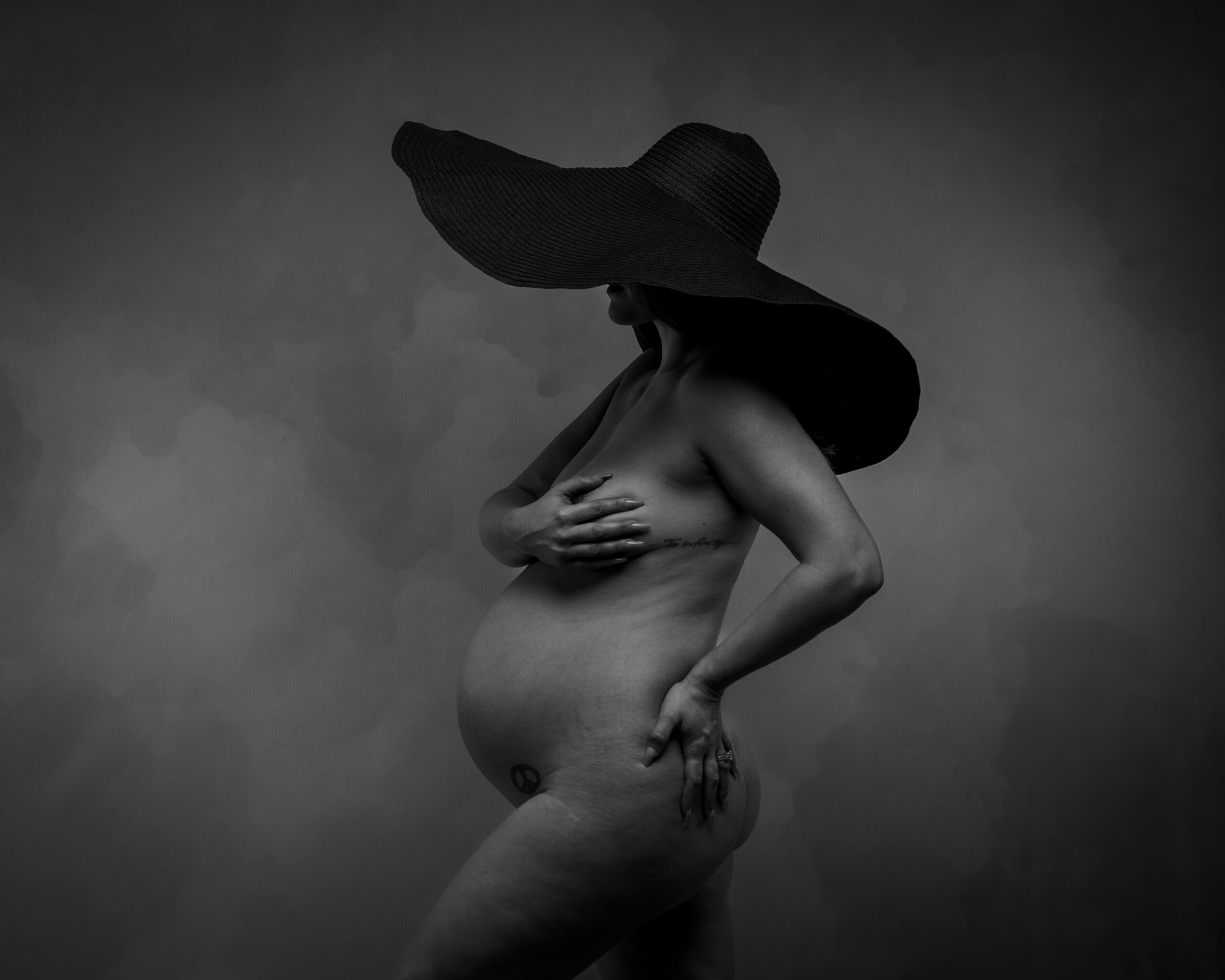 Indianapolis boudoir maternity portrait with wide brim hat and dramatic styling