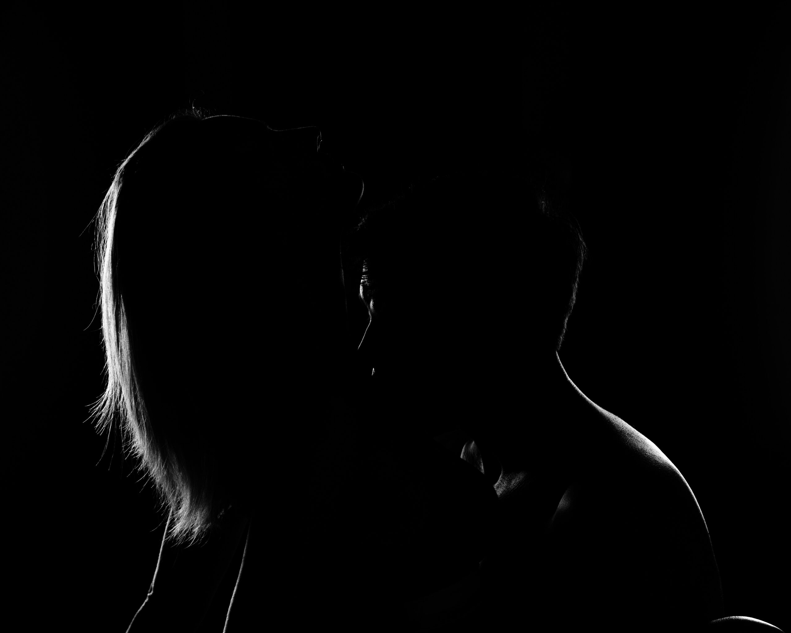 intimate couple photography silhouette with moody backlighting