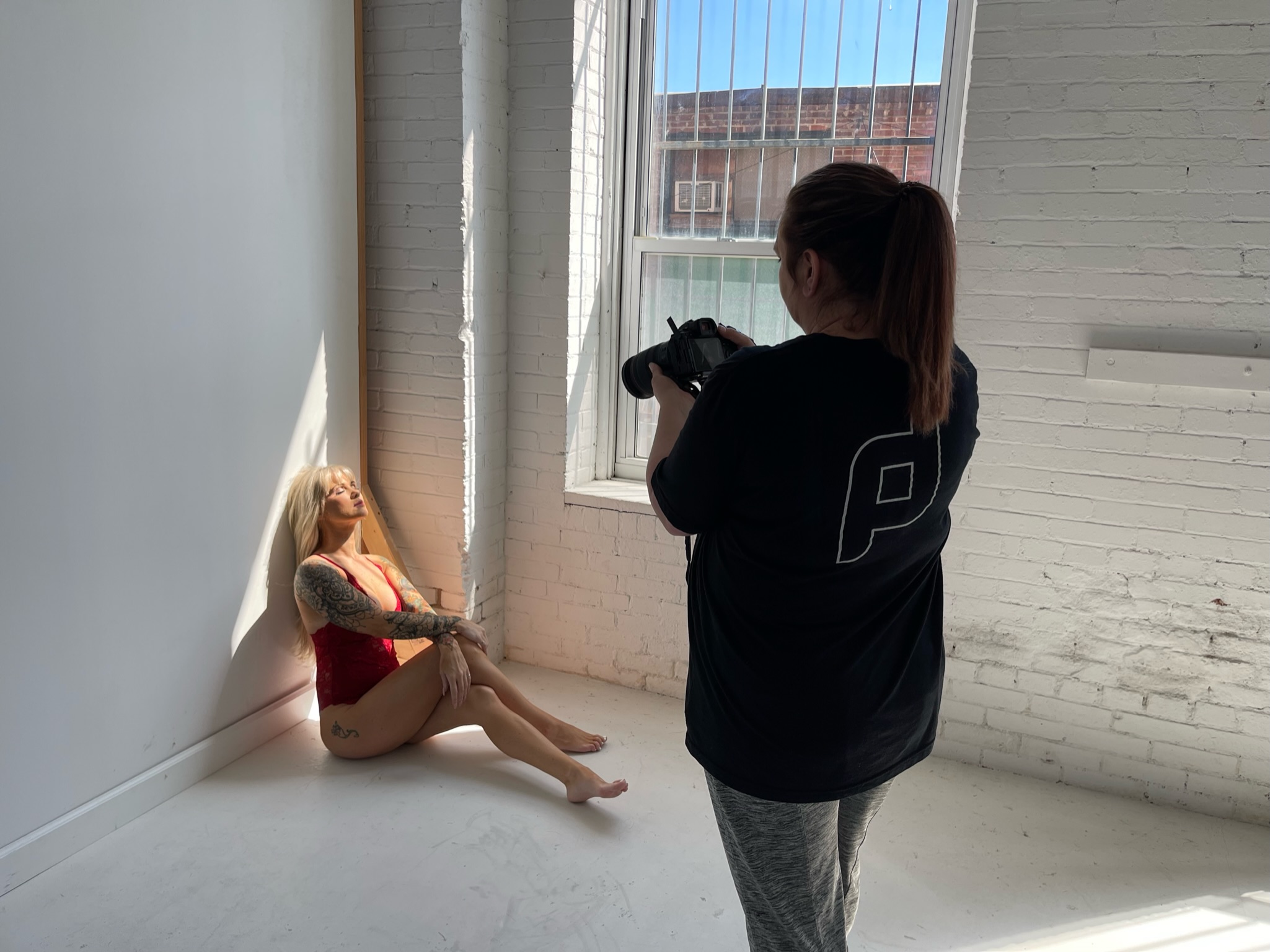 natural light boudoir photography studio near me with photographer directing pose
