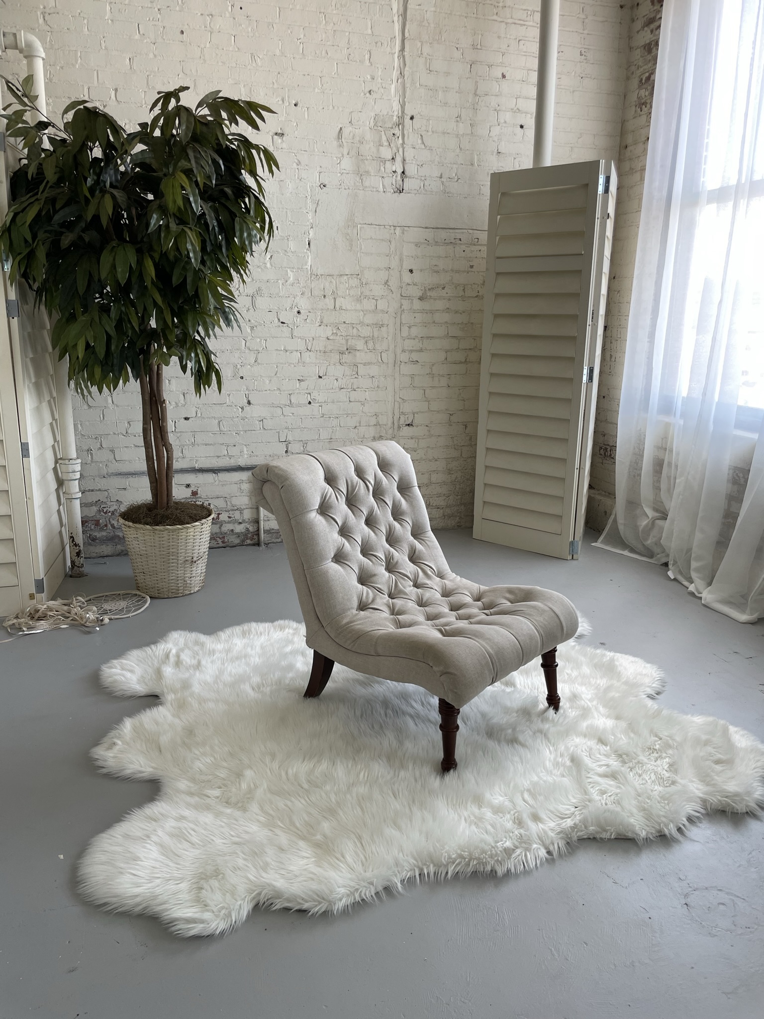 studio boudoir setup with chair prop soft textures and natural light