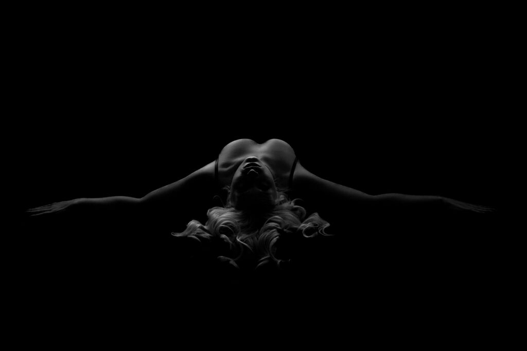 luxury boudoir photography indianapolis soft shadow portrait with arms raised