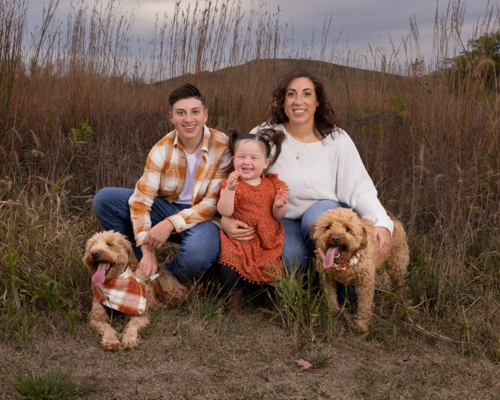 Family sitting together at Flat Fork Creek Park, a top family photo location in Indianapolis