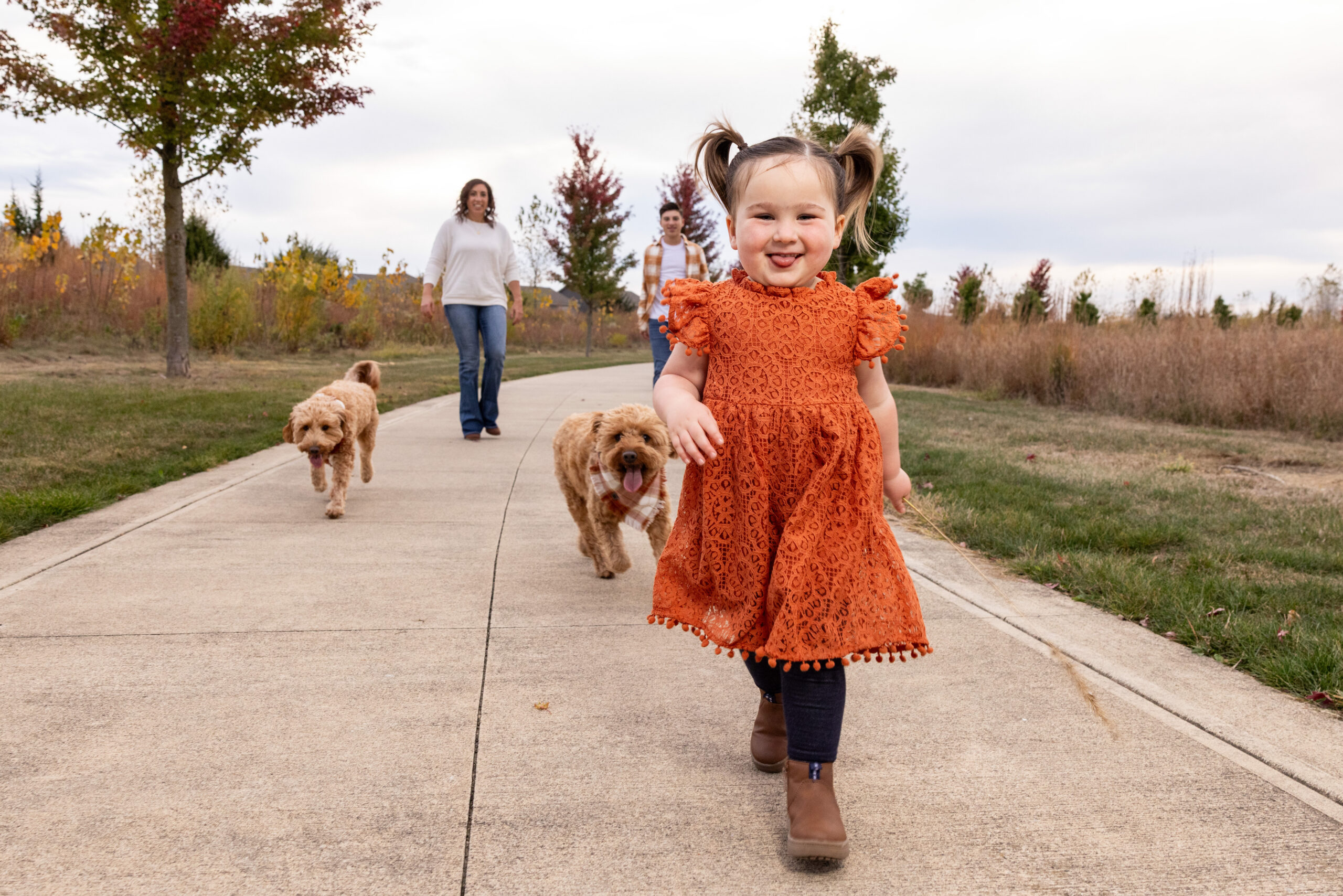 Family walking together at Flat Fork Creek Park, a top family photo location in Indianapolis