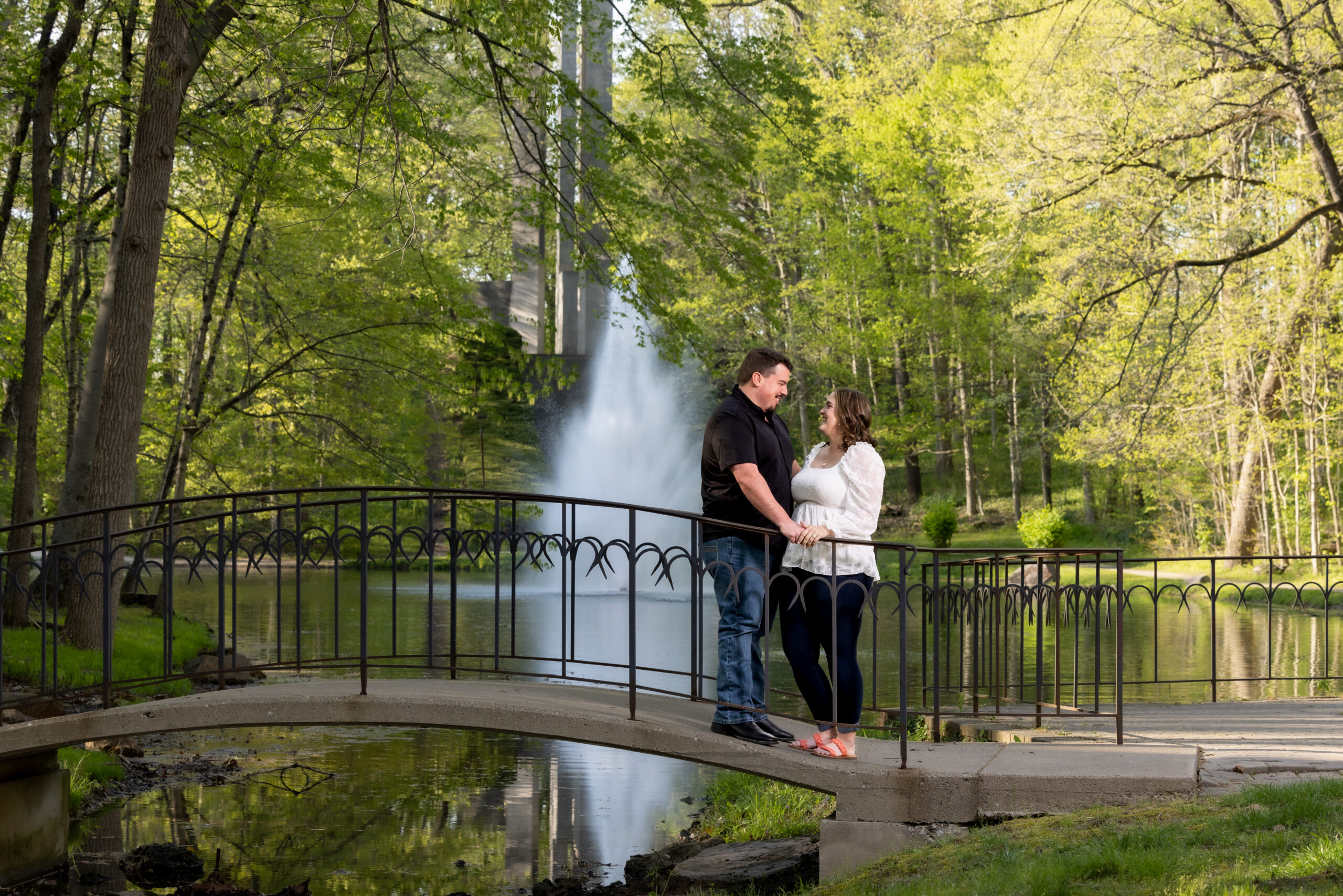 Family portrait on a stone bridge in Holcomb Gardens at Butler University