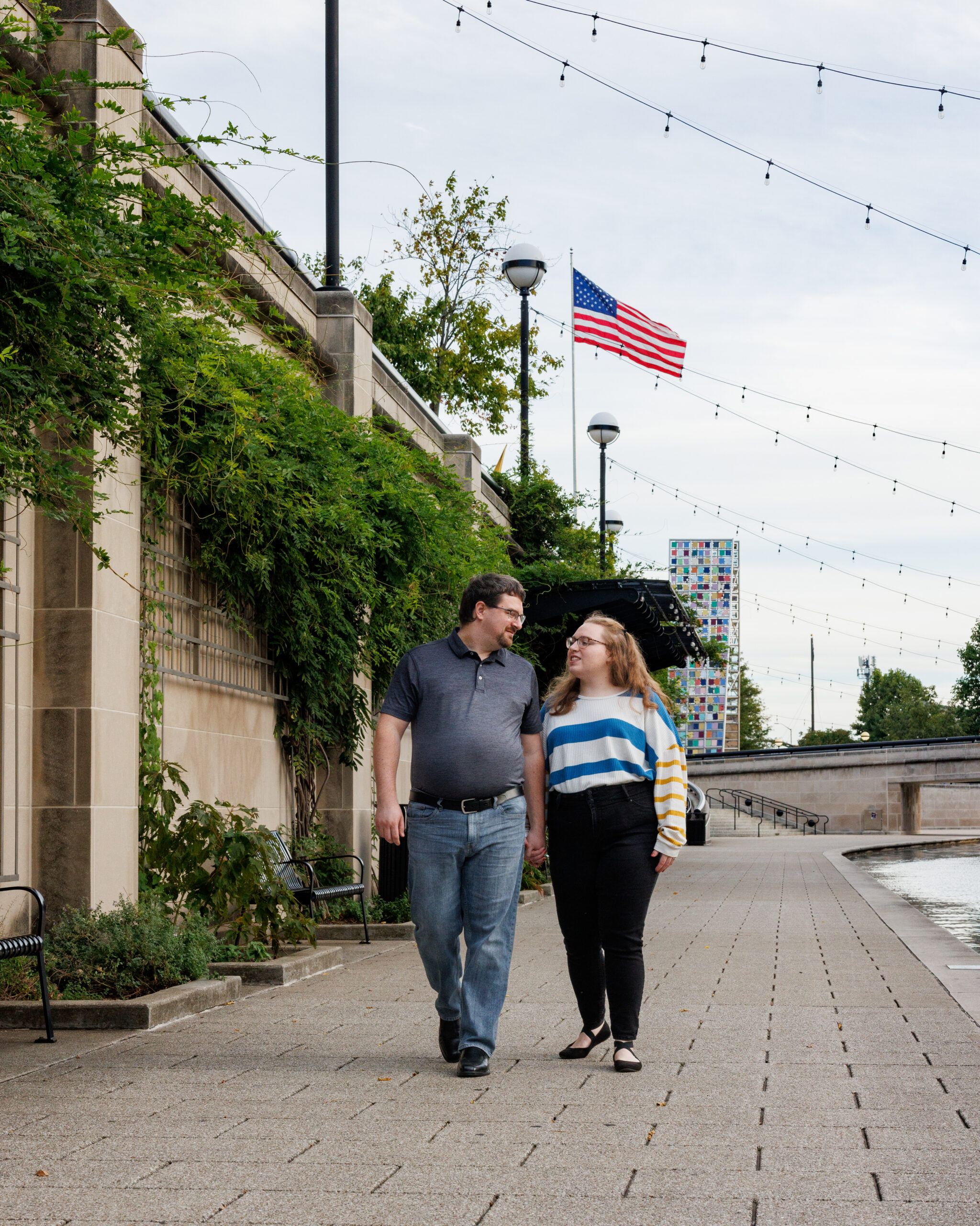 A couple walks along the Canal, a top family photo location in Indianapolis