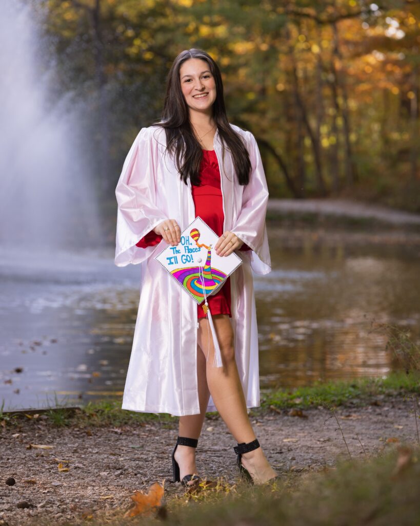 High school senior portrait session outdoors with autumn trees in Indianapolis