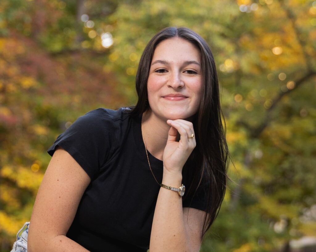 Indianapolis senior photo session featuring outdoor bridge setting with fall colors