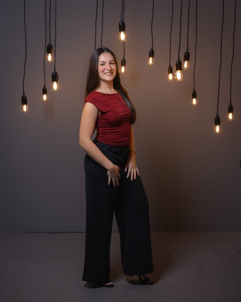 Senior studio portrait under hanging Edison bulb lights, Indianapolis senior photographer Dimensions Photography
