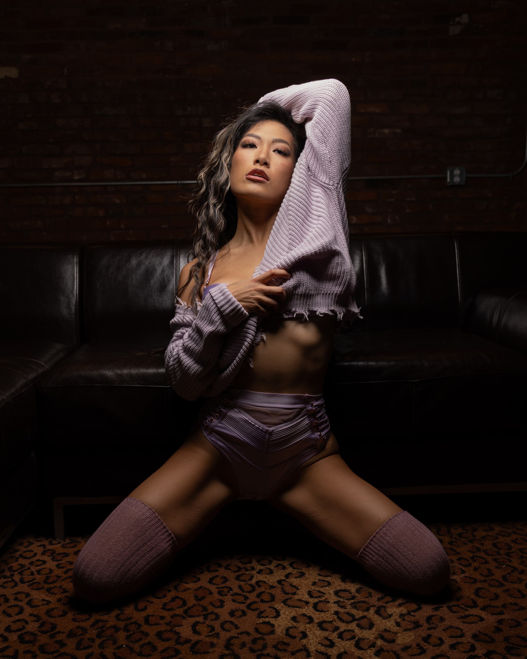 Warm, low-key studio lighting in a dark industrial setting