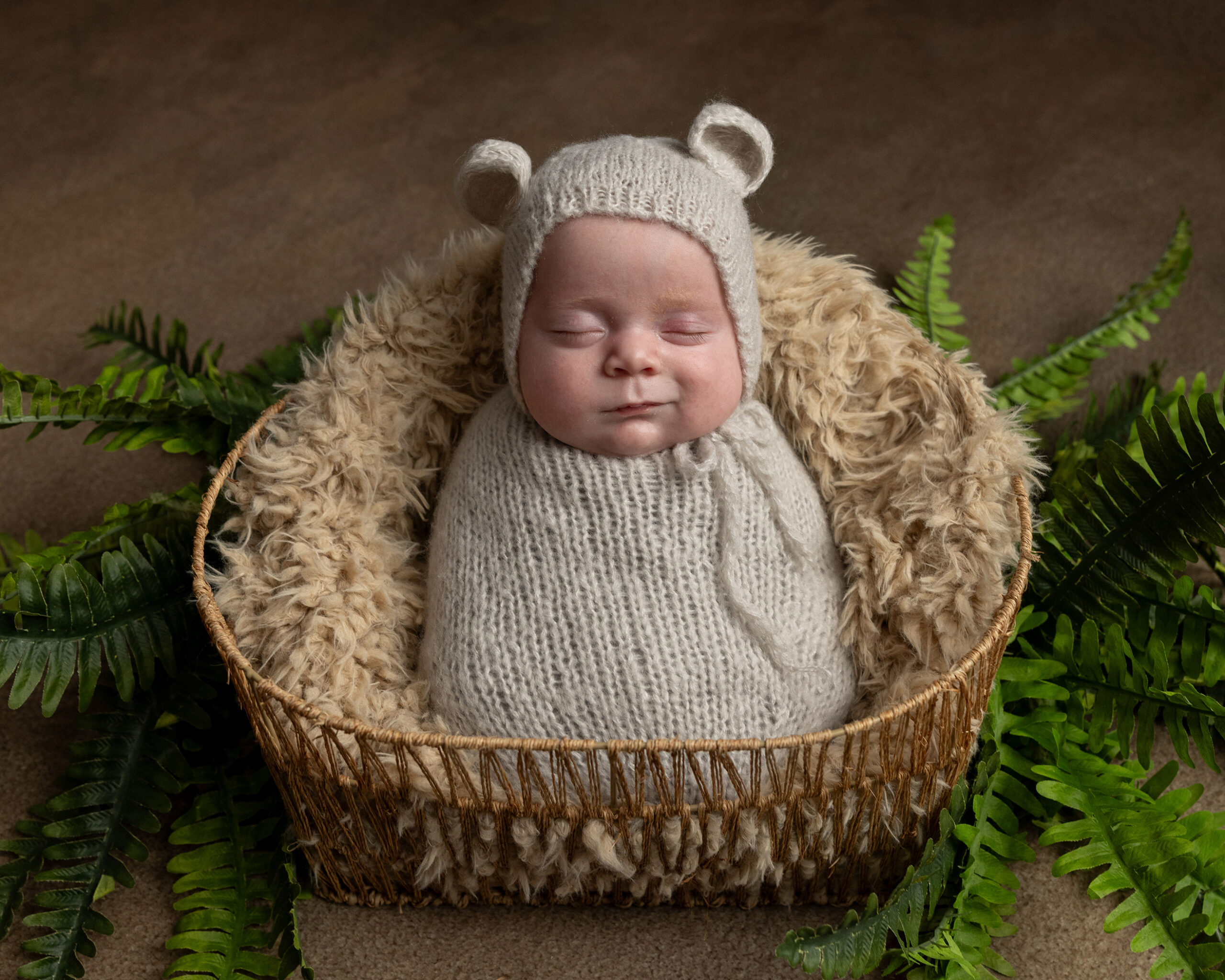Sleeping newborn in bear bonnet, grow with me photography package newborn session