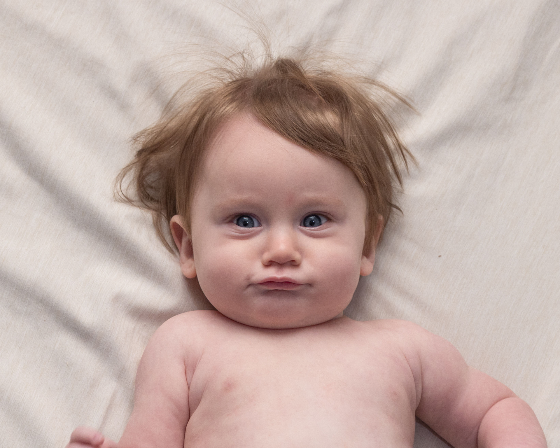 a 6 month old baby at a photography studio in indianapolis doing a sitter session